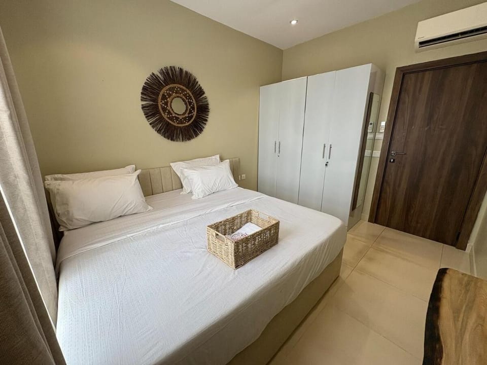 Cozy Waterfront 2BR with Pool & Warm Wood Accents Apartment in Lagos, Nigeria