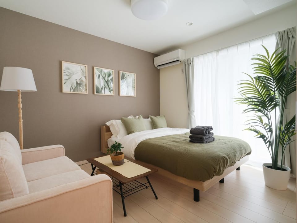 Bed, Living room, Seating area, Bedroom, air conditioner