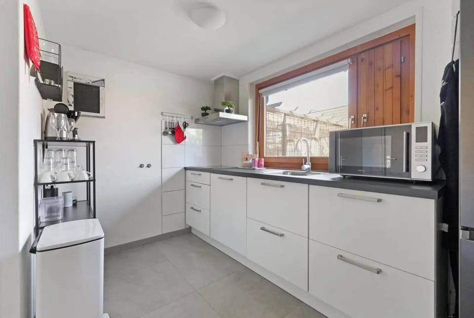 Kitchen or kitchenette, dishwasher, oven, stove
