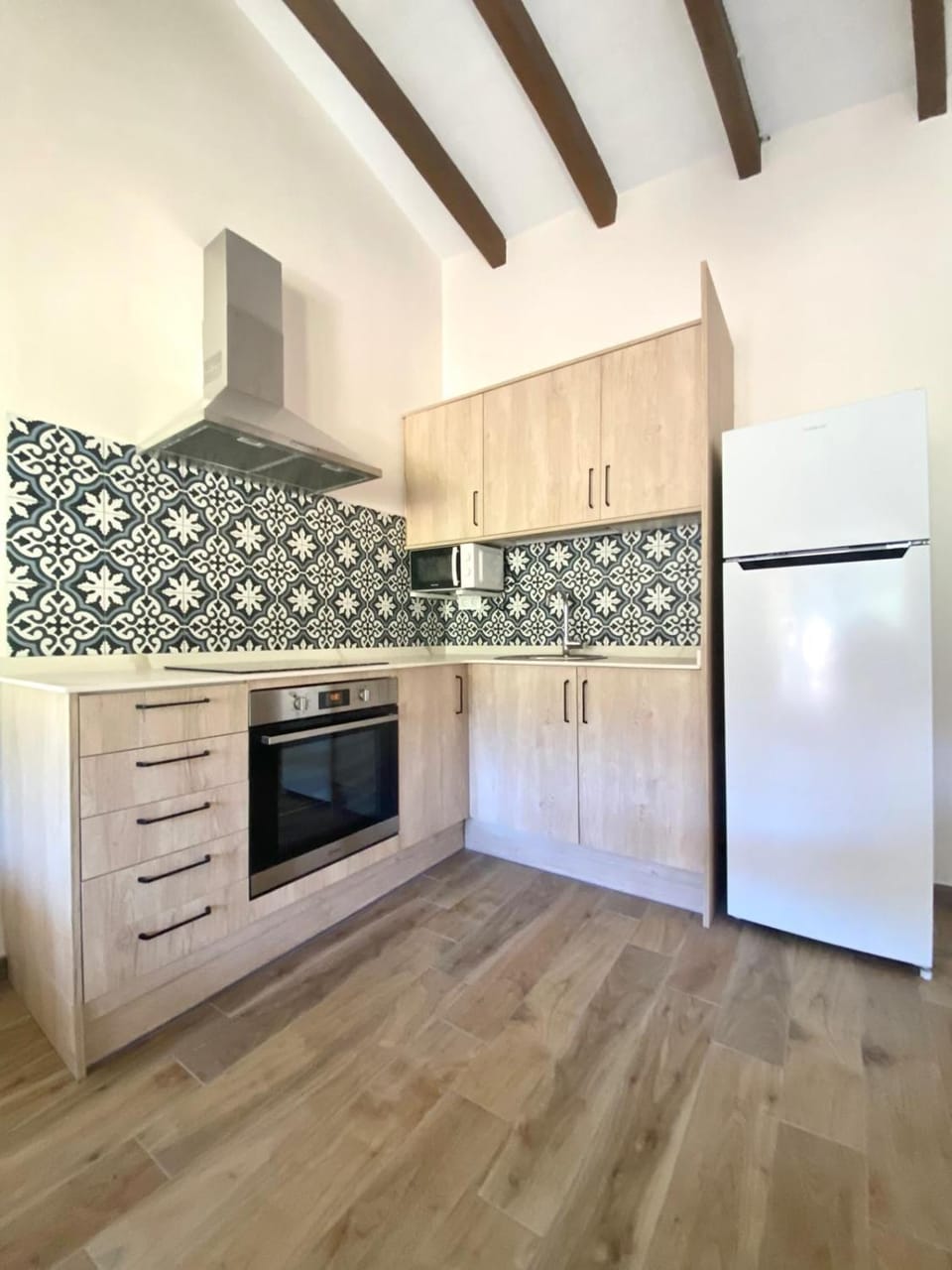 Kitchen or kitchenette, heating, microwave, oven, stove, toaster, air conditioner