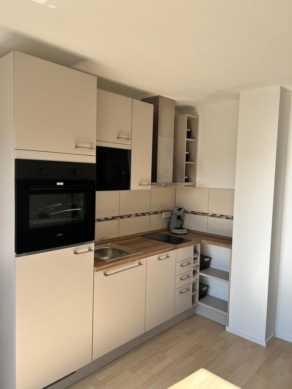 Kitchen or kitchenette, dishwasher, oven, stove
