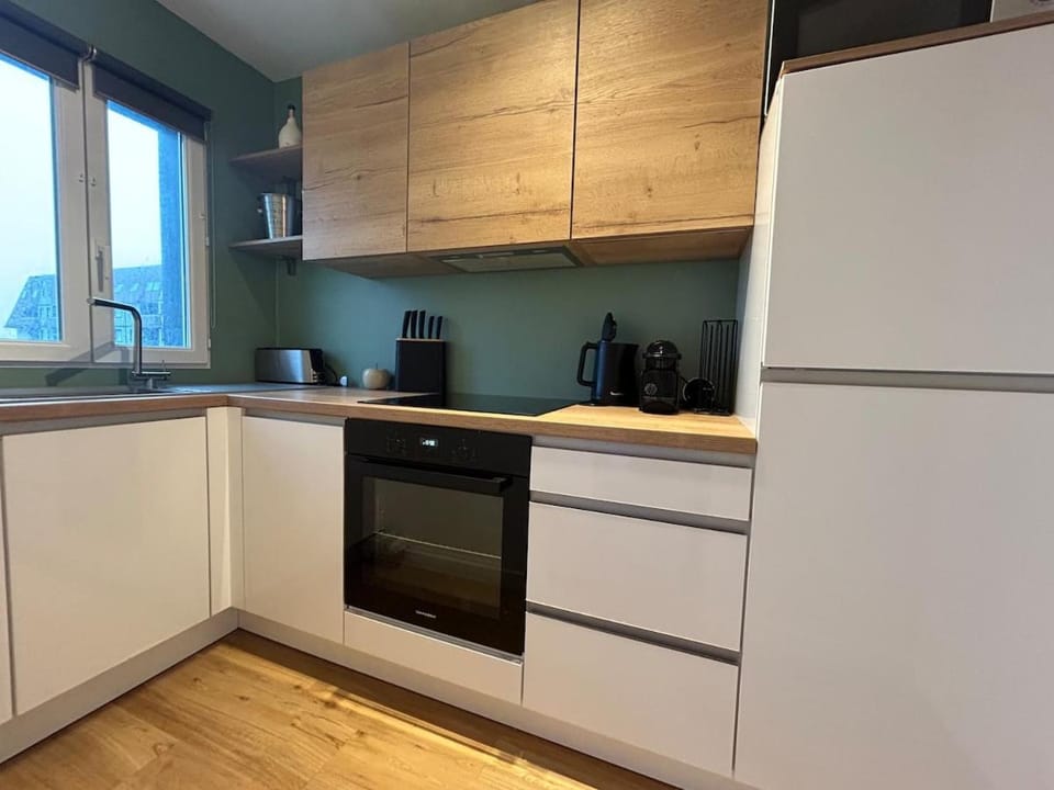 Kitchen or kitchenette, dishwasher, oven, stove, toaster