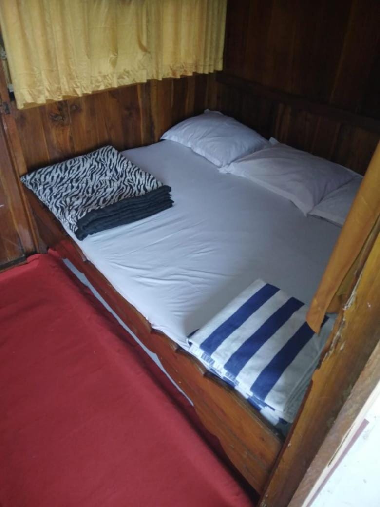 Semi Phinisi boat Labuan Bajo Komodo Tour Docked boat in Indonesia