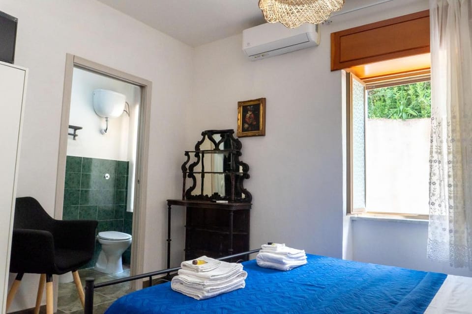 Bed, Photo of the whole room, Bedroom, towels, air conditioner