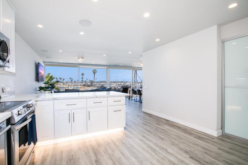 Kitchen or kitchenette, dishwasher, microwave, oven, stove
