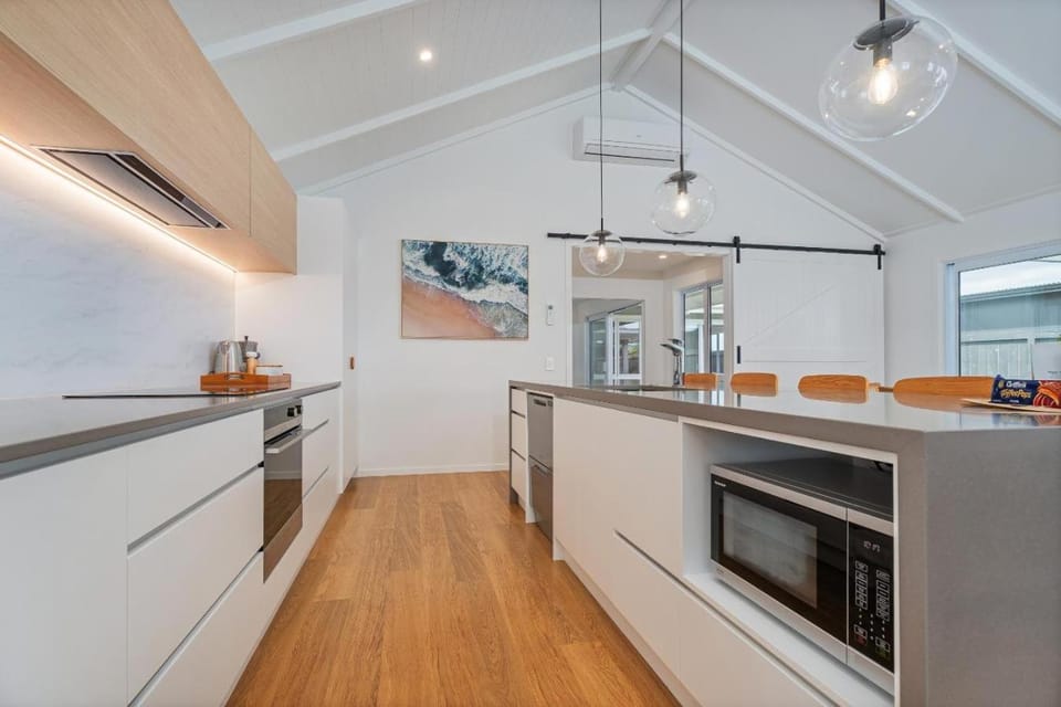 Kitchen or kitchenette, dishwasher, oven, stove, air conditioner