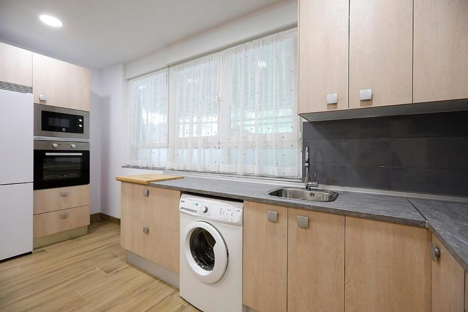 Kitchen or kitchenette, washing machine