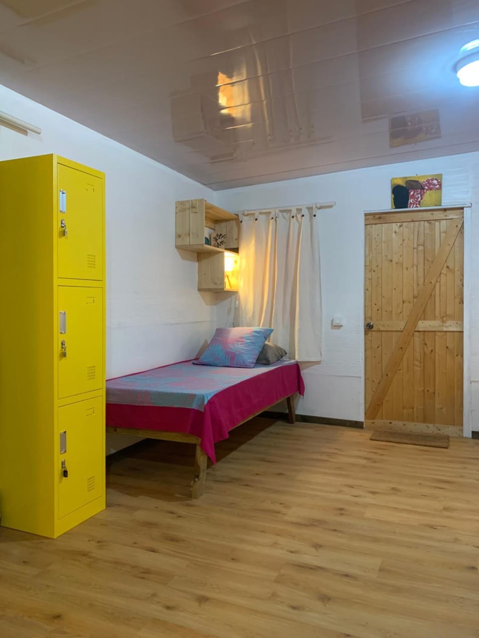 Bed, locker, towels