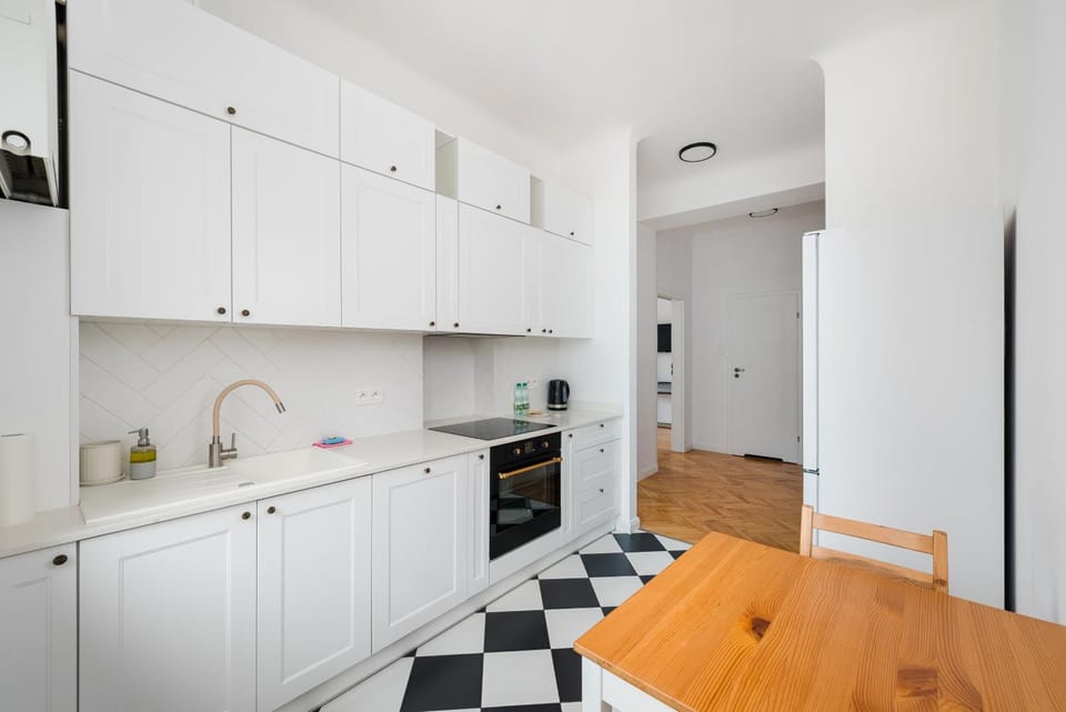 Kitchen or kitchenette, dishwasher, oven, stove