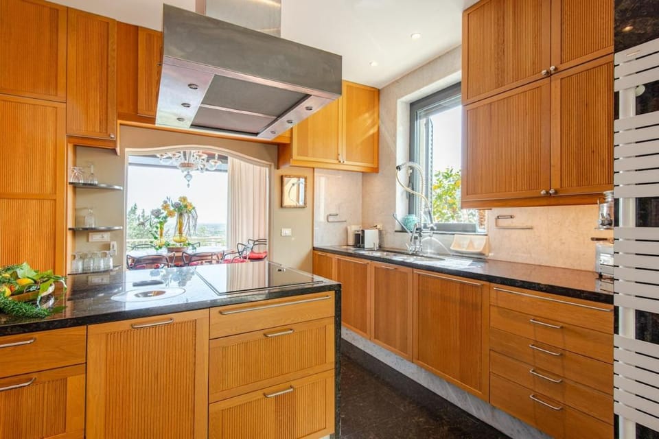 Kitchen or kitchenette, dishwasher, oven, stove