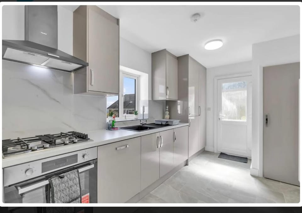 Kitchen or kitchenette, dishwasher, oven, stove