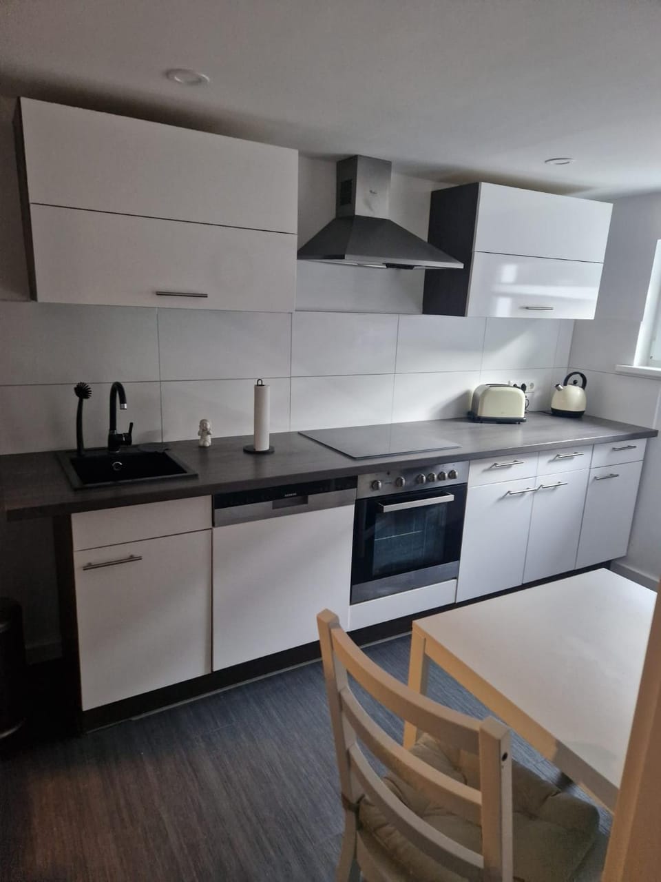 Kitchen or kitchenette, Dining area, dishwasher, stove, toaster