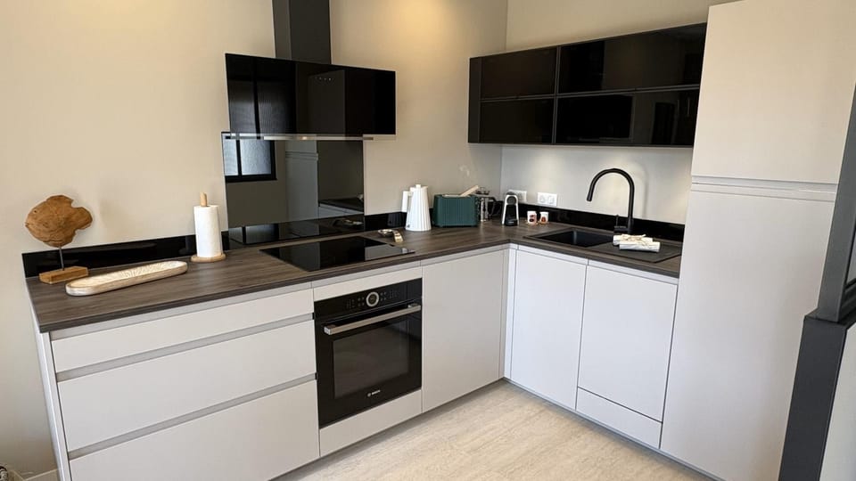 Kitchen or kitchenette, dishwasher, oven, stove