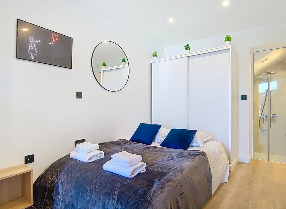 Bed, towels, wardrobe