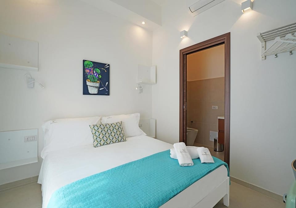 Bed, Photo of the whole room, Bedroom, towels, air conditioner