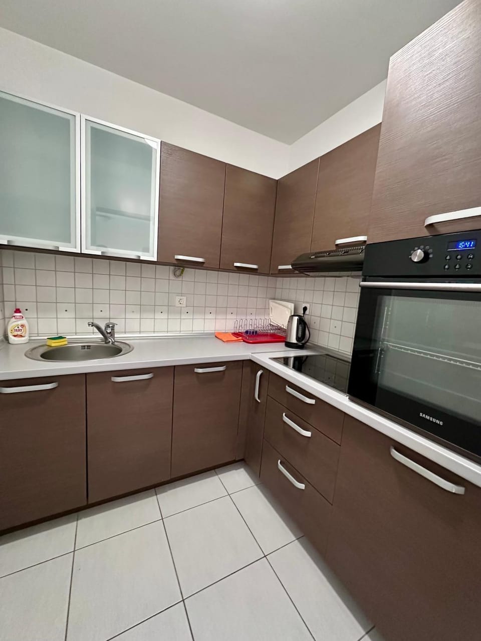 Kitchen or kitchenette, dishwasher, oven, stove