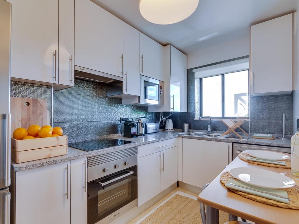 Kitchen or kitchenette, Dining area, dishwasher, stove, toaster