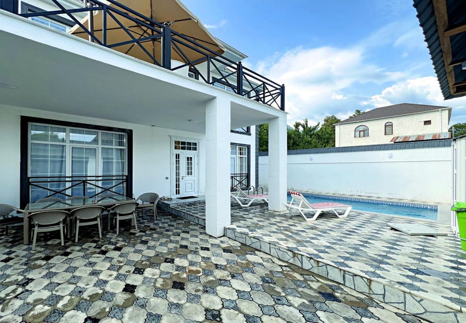 Property building, Patio, Day, View (from property/room), Pool view, Swimming pool, sunbed