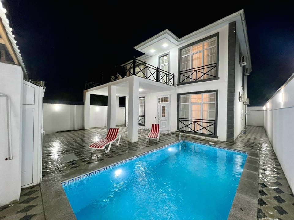 Property building, Patio, Night, Pool view, Swimming pool, sunbed