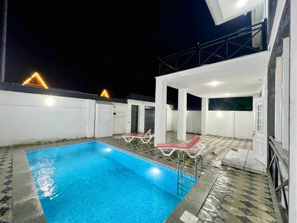 Patio, Night, Pool view, Swimming pool, sunbed