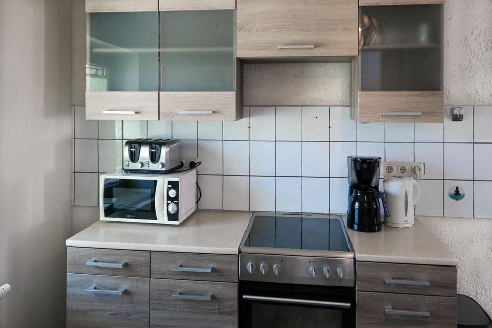 Kitchen or kitchenette, microwave, oven, stove, toaster