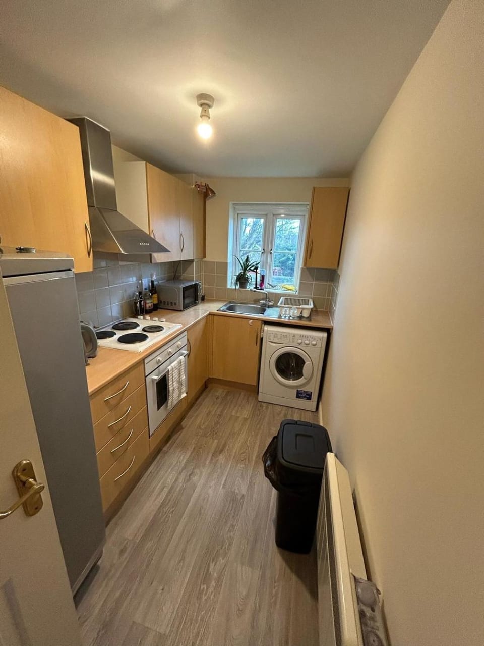 Kitchen or kitchenette, microwave, oven, stove, washing machine