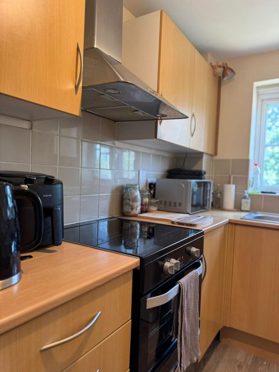 Kitchen or kitchenette, microwave, oven, stove