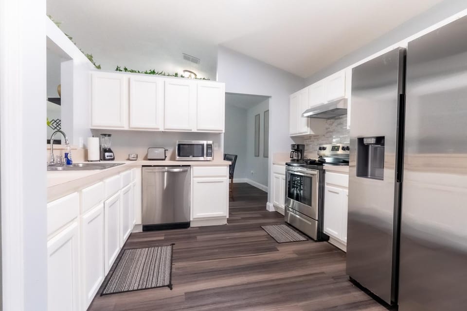 Kitchen or kitchenette, dishwasher, stove, toaster
