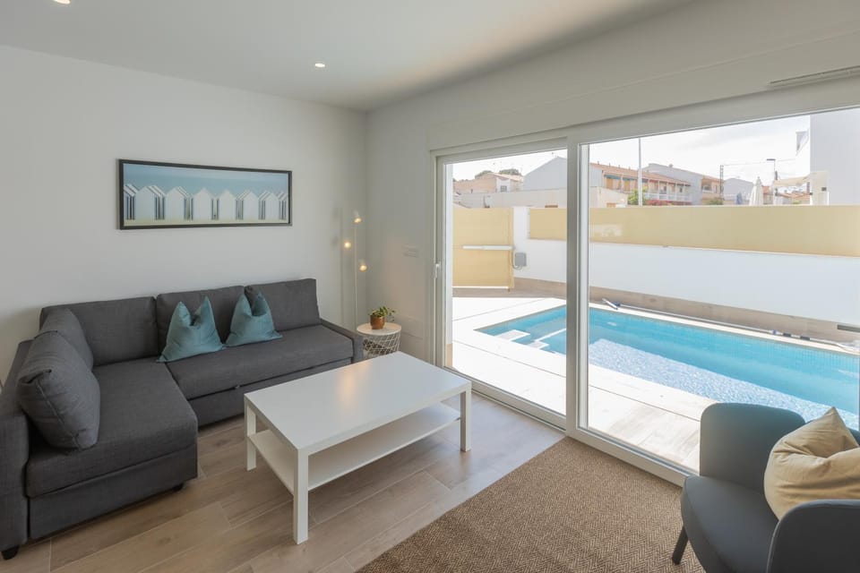 Living room, Seating area, Pool view