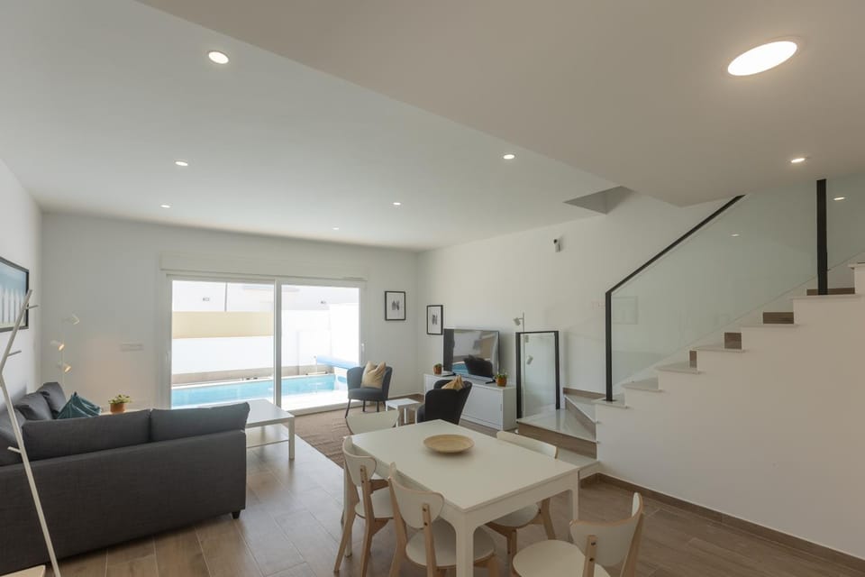 Living room, Seating area, Dining area, Pool view
