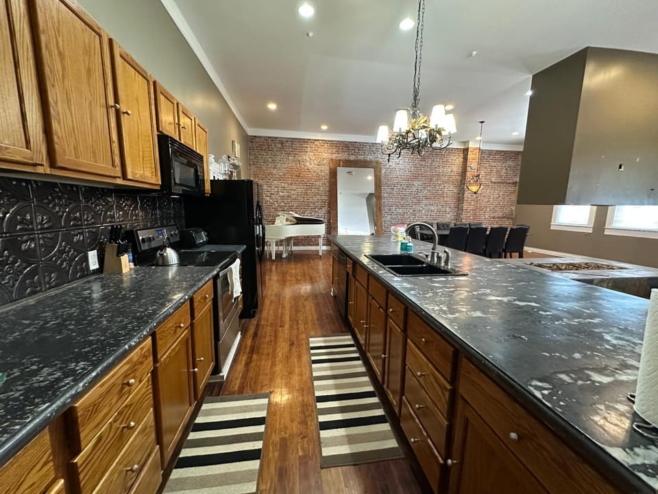 Kitchen or kitchenette, dishwasher, oven, stove