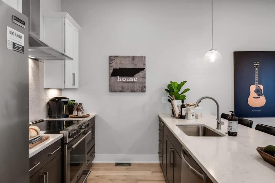 Kitchen or kitchenette, dishwasher, oven, stove, toaster