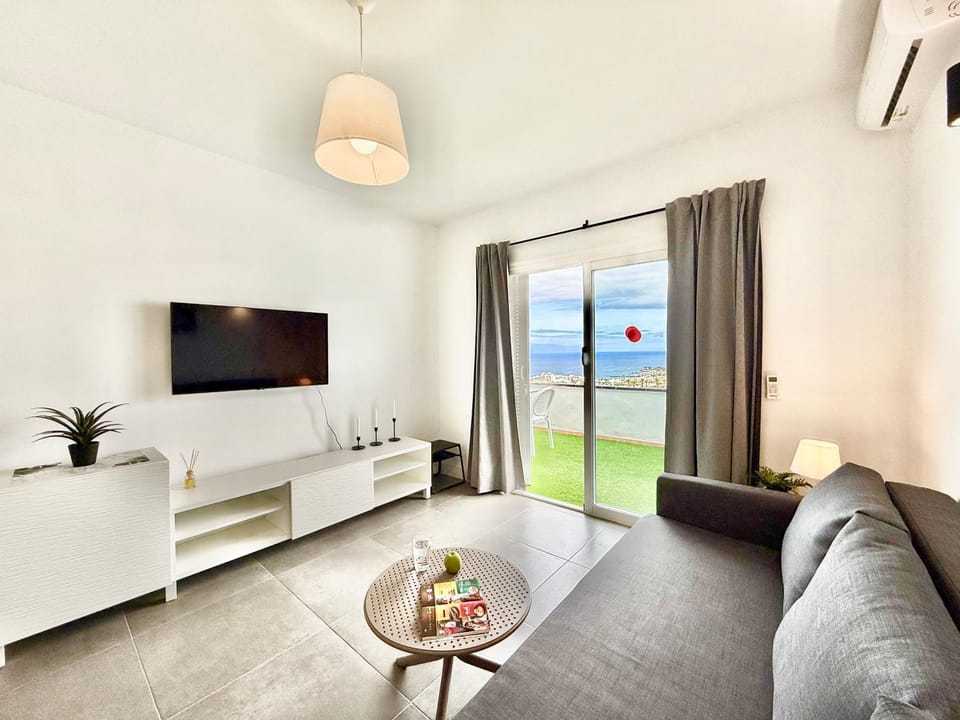 TV and multimedia, Living room, Seating area, Sea view, air conditioner