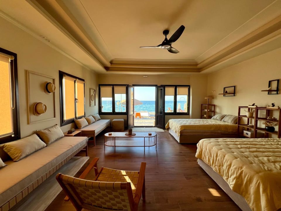 Bed, Living room, Seating area, Bedroom, Sea view