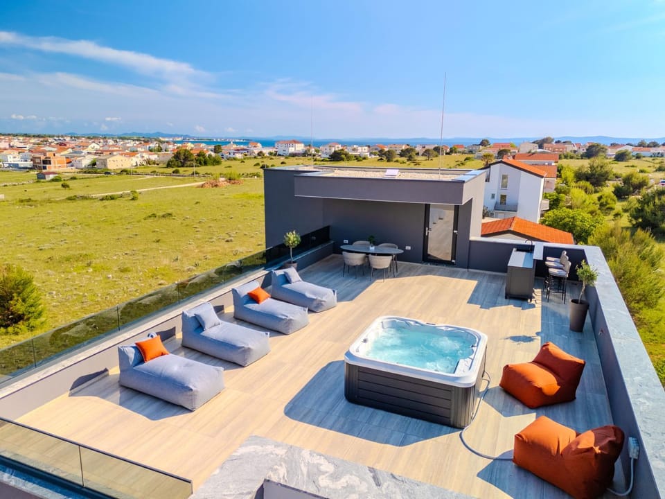 Property building, Day, Natural landscape, Hot Tub, View (from property/room), Balcony/Terrace, Balcony/Terrace, Seating area, Pool view, Sea view, Swimming pool, sunbed