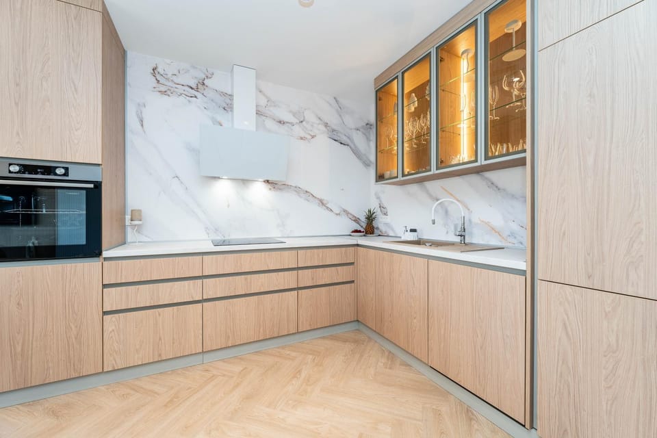 Kitchen or kitchenette, dishwasher, oven, stove