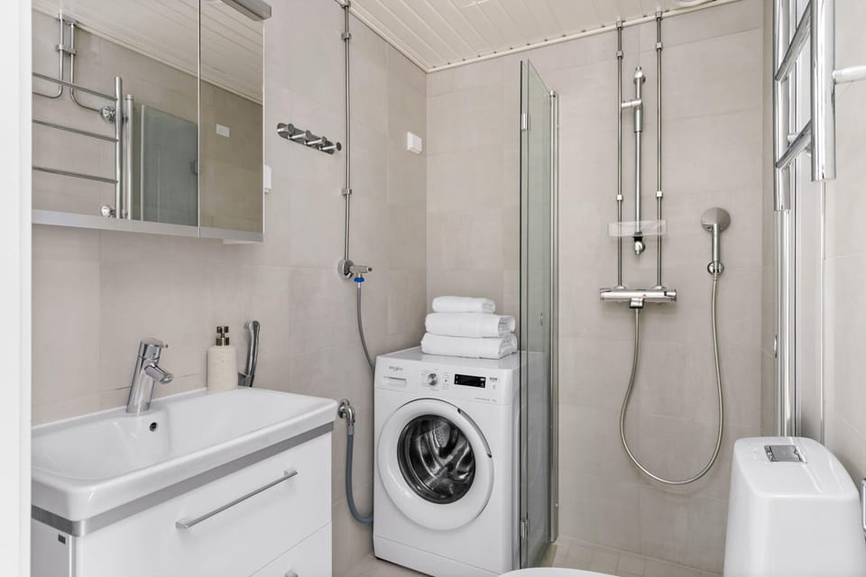 Shower, Toilet, Bathroom, towels, washing machine, dryer