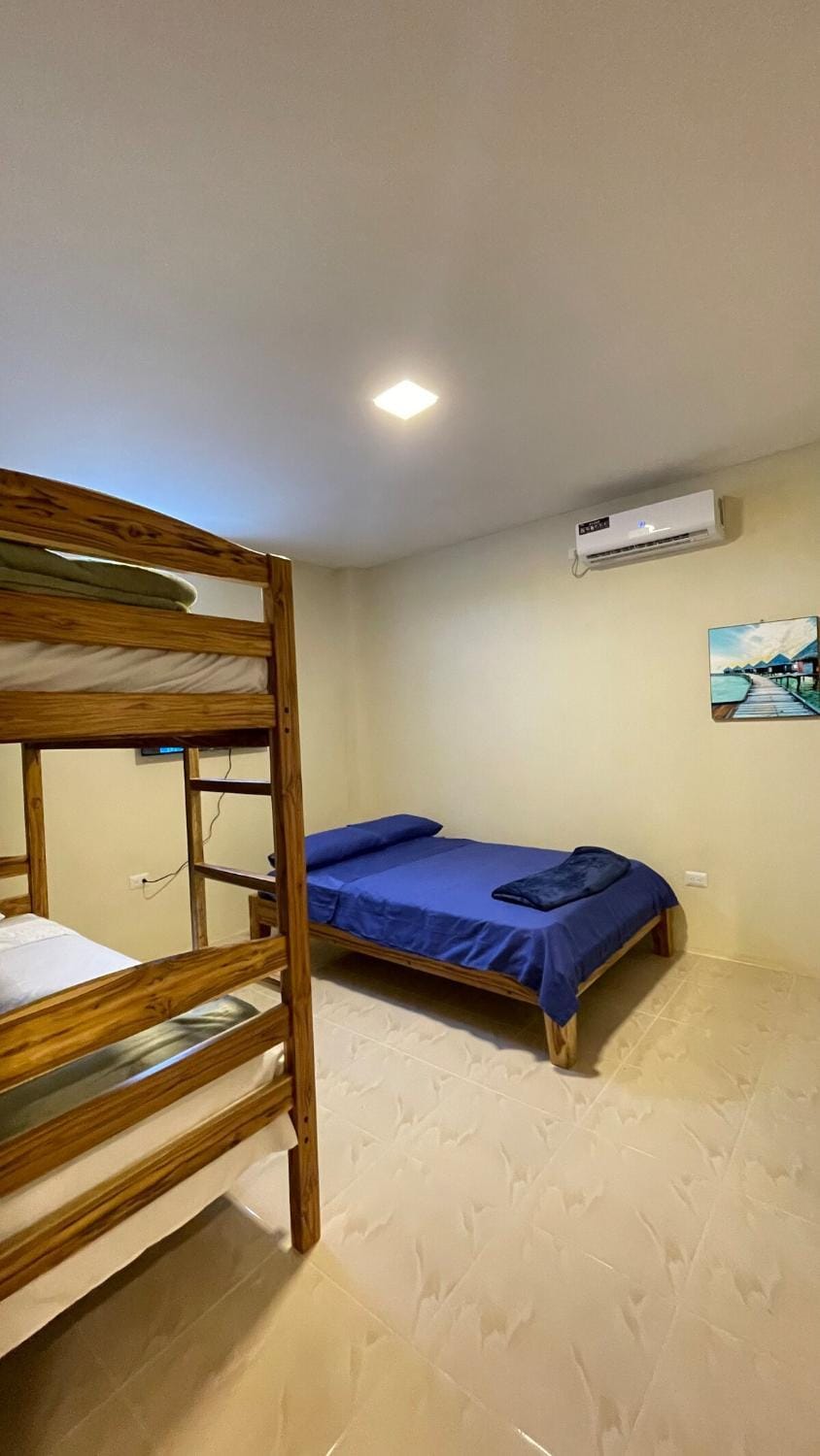 Bed, Photo of the whole room, Bedroom, bunk bed, towels, air conditioner