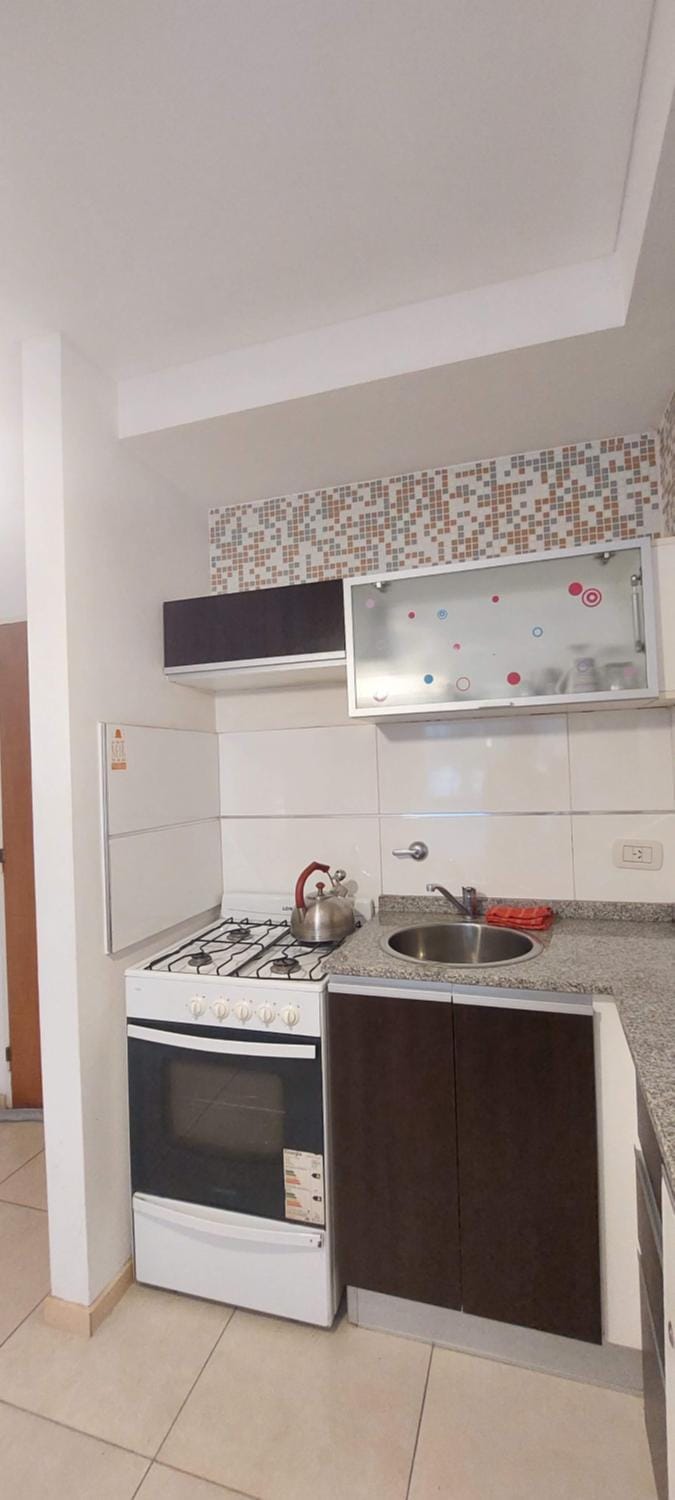 Kitchen or kitchenette, oven, stove