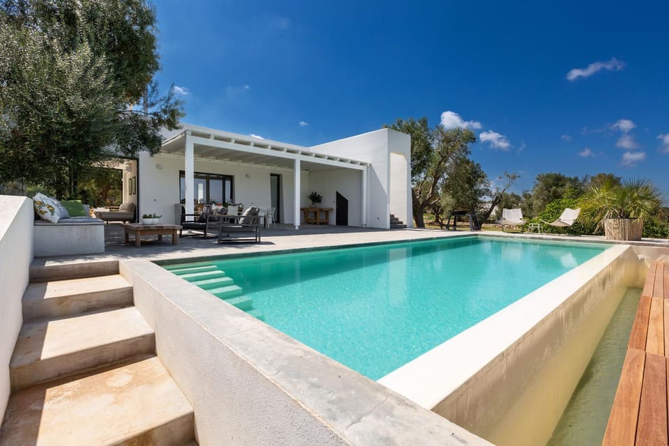 Property building, Patio, Pool view, Swimming pool, sunbed