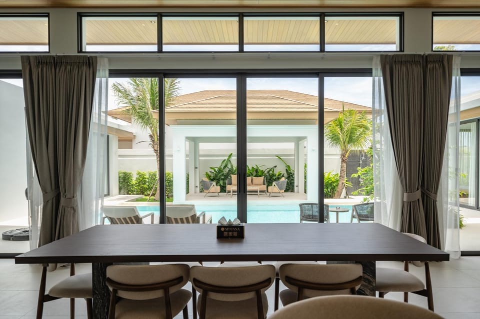 Living room, Seating area, Dining area, Pool view