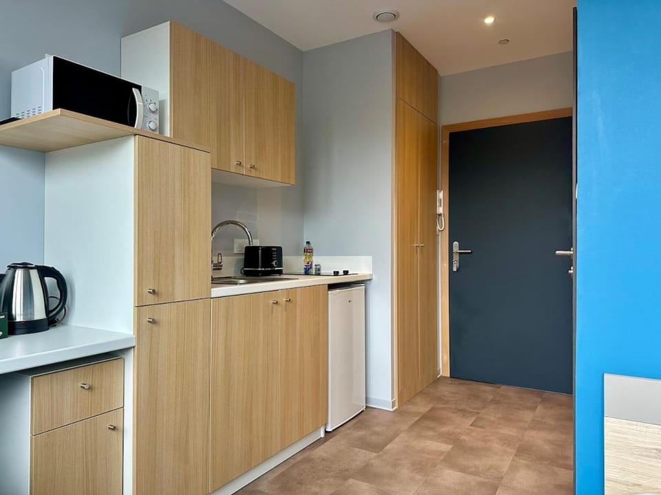 Kitchen or kitchenette, stove, toaster