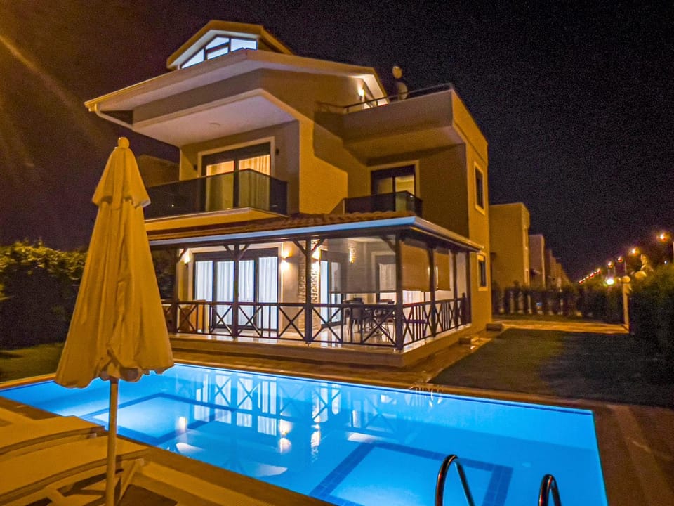 Property building, Patio, Night, Pool view, Swimming pool, sunbed