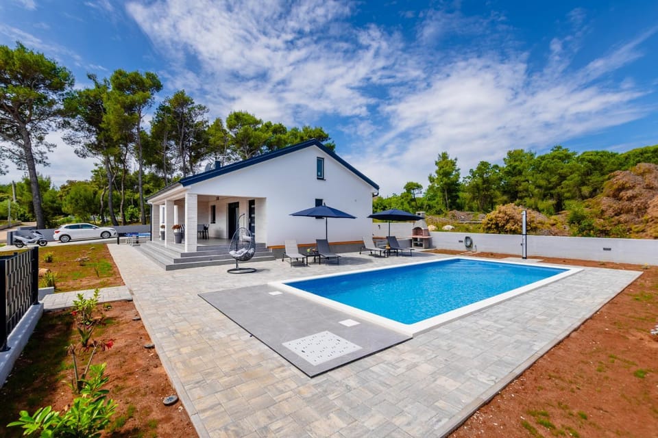 Property building, Day, Natural landscape, Pool view, Swimming pool, sunbed