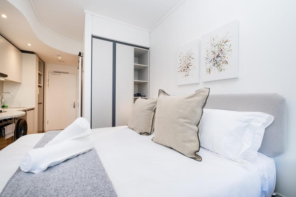 Bed, towels, wardrobe