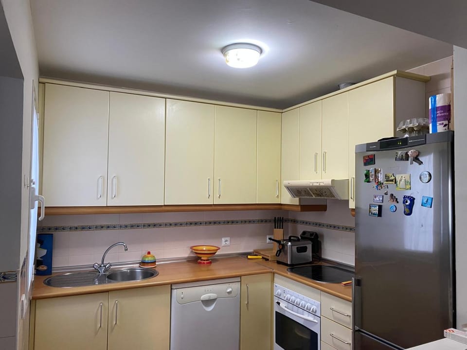 Kitchen or kitchenette, dishwasher, oven, stove, toaster