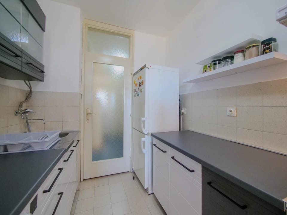 Kitchen or kitchenette, dishwasher, oven, stove