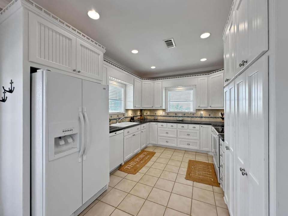 Kitchen or kitchenette, dishwasher, oven, stove