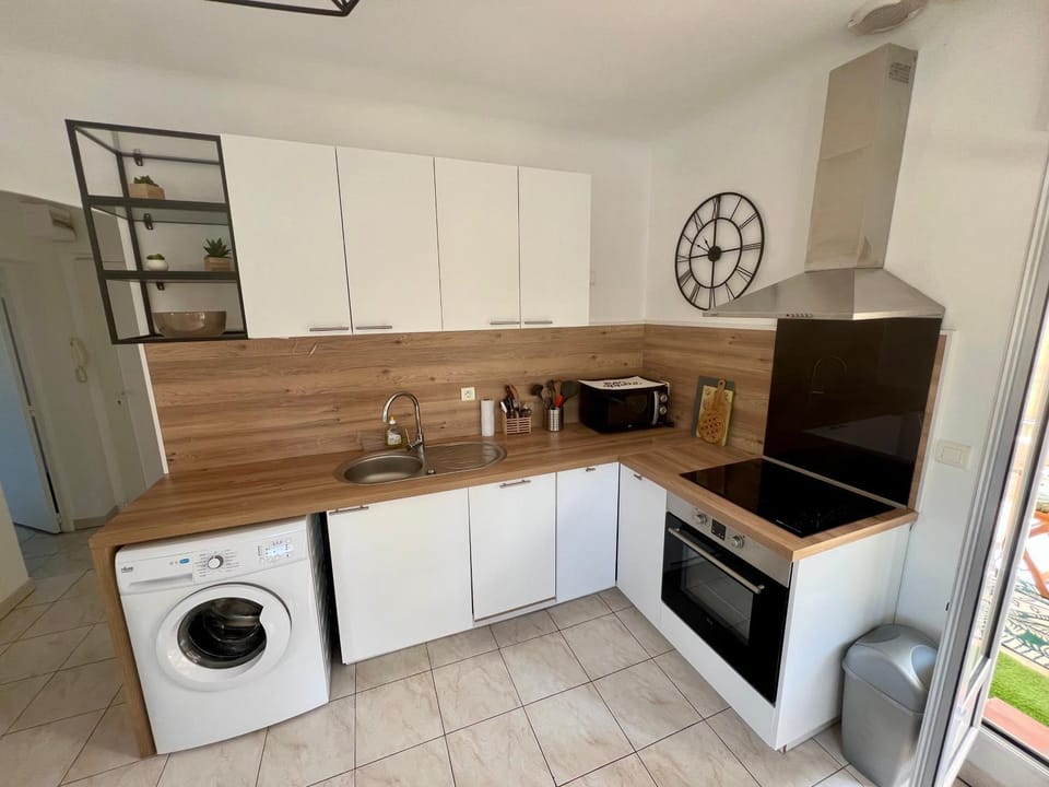 Kitchen or kitchenette, dishwasher, oven, stove, washing machine