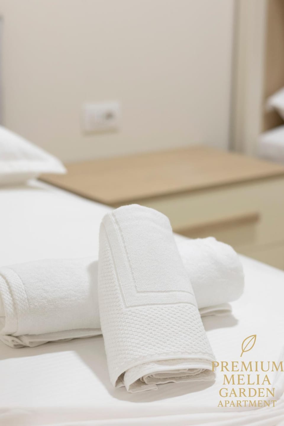 Bed, Photo of the whole room, Bedroom, Text overlay, towels